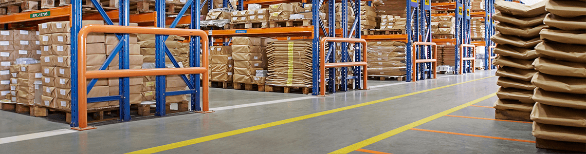 A warehouse aisle with wayfinding floor marking tape