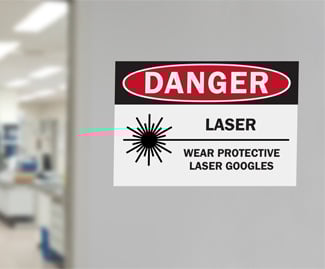 Signs warn of hazards when using lasers